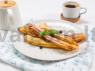 Ispaniškas desertas churros. pagrindine nuotrauka