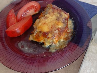 Kiauliena po pomidorais ir sūriu pagrindine nuotrauka