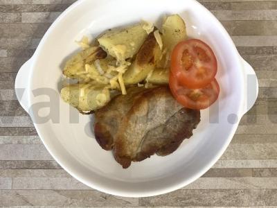 Kiaulienos kotletas su bulvių skiltelėmis pagrindine nuotrauka